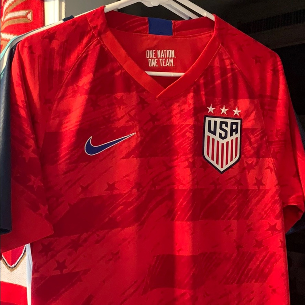 Bundle of USMNT and USWNT men’s small jerseys.